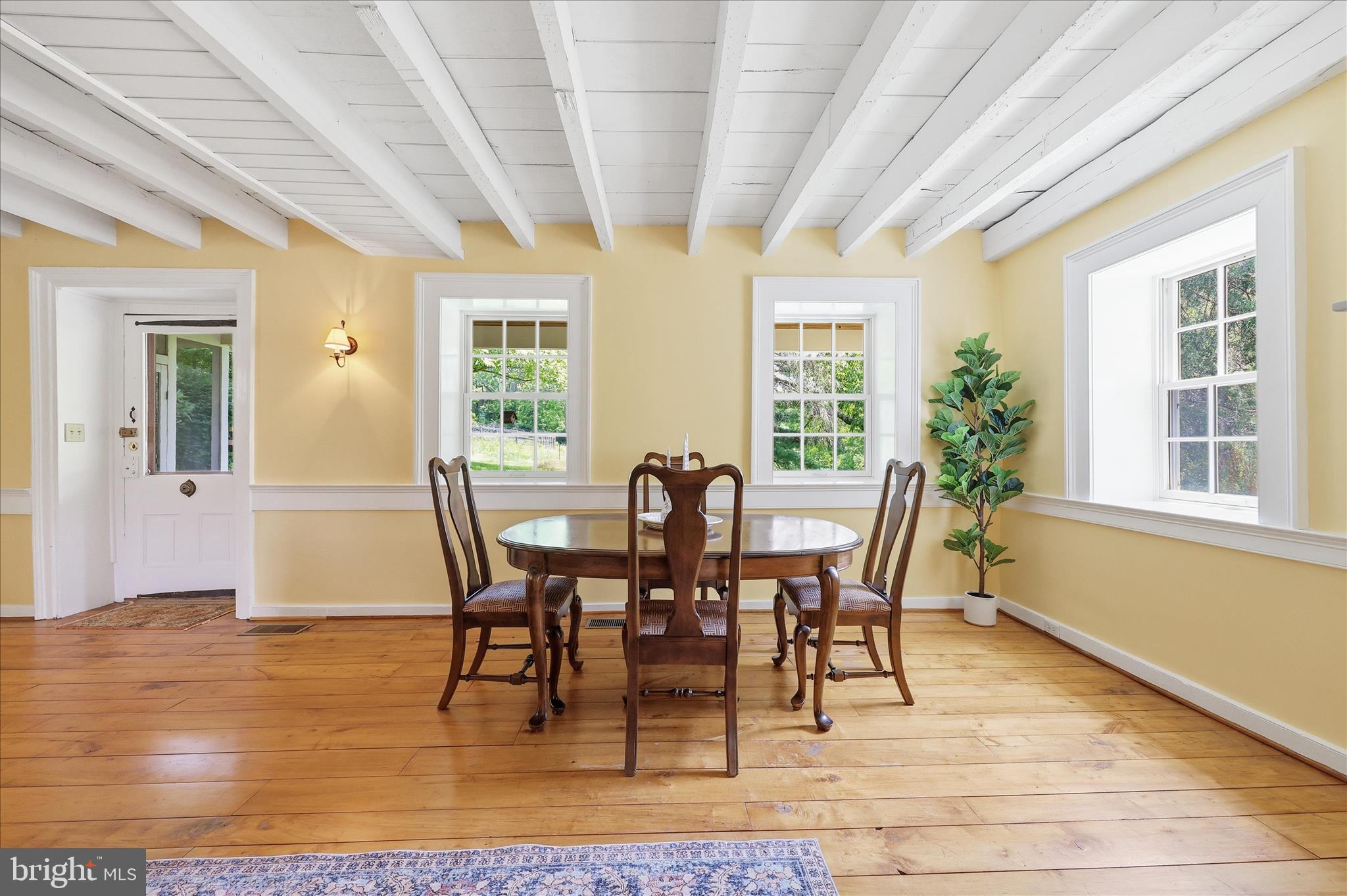 10919 Etzler Mill Road Woodsboro, MD 21798 - Photo 7 of 54 a view of a dining room with furniture and wooden floor