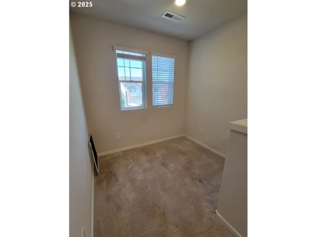 a view of a room with a hallway