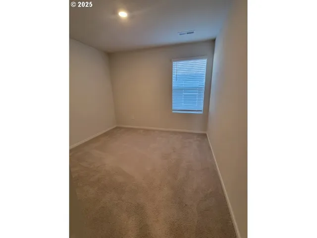 a view of a room with a hallway