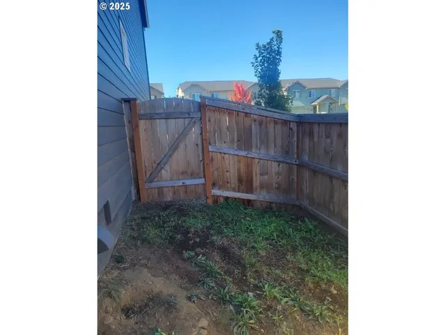 a kitchen with stainless steel appliances a refrigerator and a stove top oven