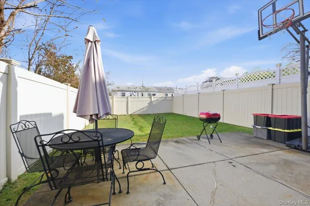 a view of a chairs and table in patio