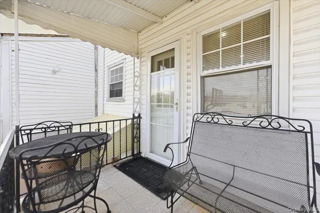a view of a balcony with chair