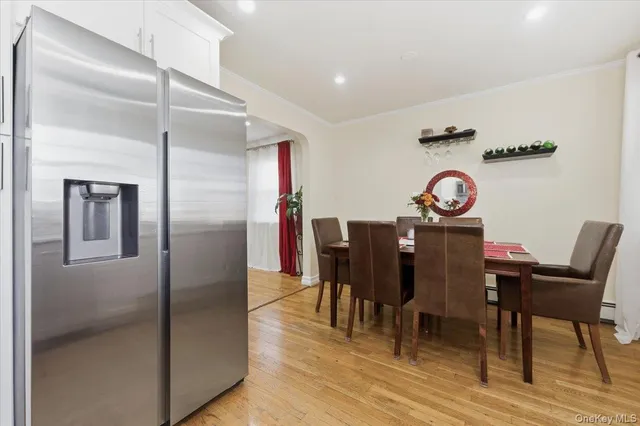 a view of a dining room with furniture and wooden floor