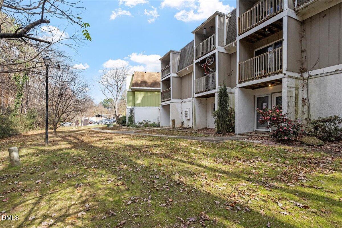 7124 Longstreet Drive, Unit C Raleigh, NC 27615 - Photo 2 of 27 a view of a house with a yard