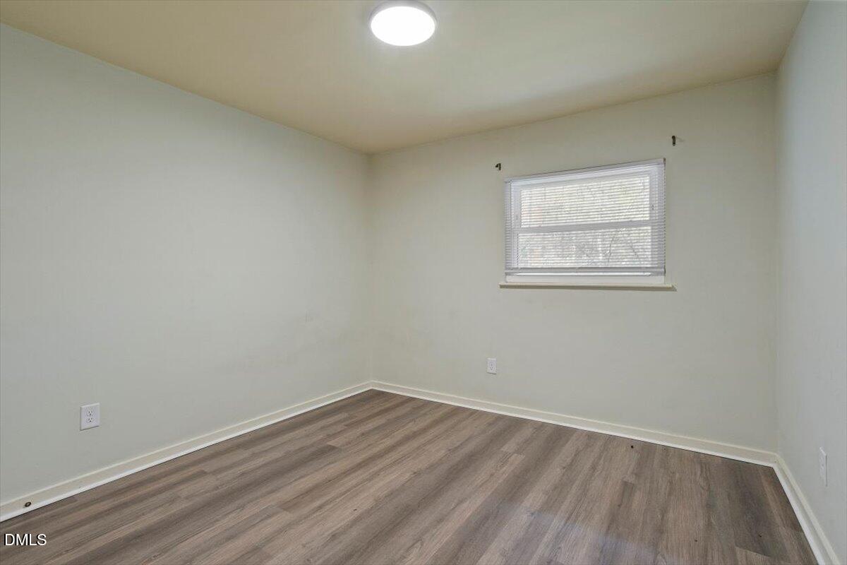 7124 Longstreet Drive, Unit C Raleigh, NC 27615 - Photo 26 of 27 an empty room with a window