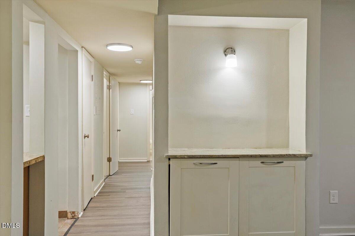 7124 Longstreet Drive, Unit C Raleigh, NC 27615 - Photo 8 of 27 a view of a hallway with wooden floor