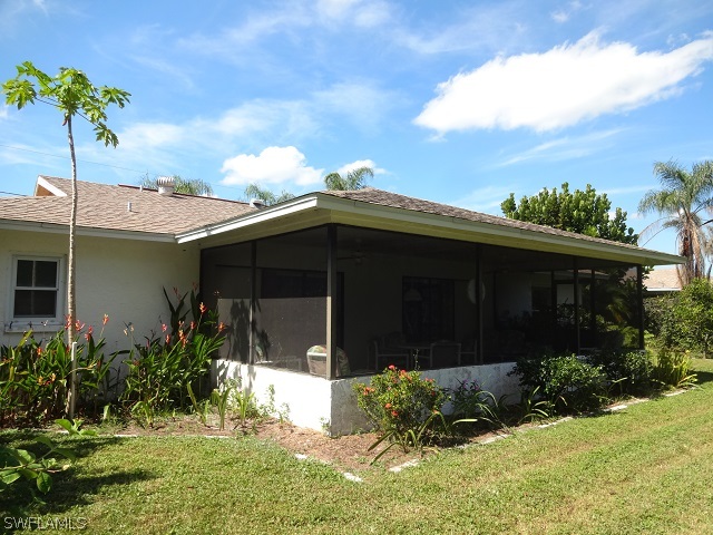 17537 Laurel Valley Road Fort Myers, FL 33967 - Photo 13 of 16 a front view of a house with a yard