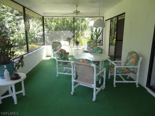 17537 Laurel Valley Road Fort Myers, FL 33967 - Photo 16 of 16 a dining room with furniture and a garden view
