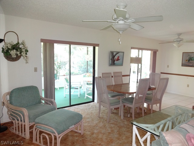 17537 Laurel Valley Road Fort Myers, FL 33967 - Photo 3 of 16 a living room with furniture and a large window