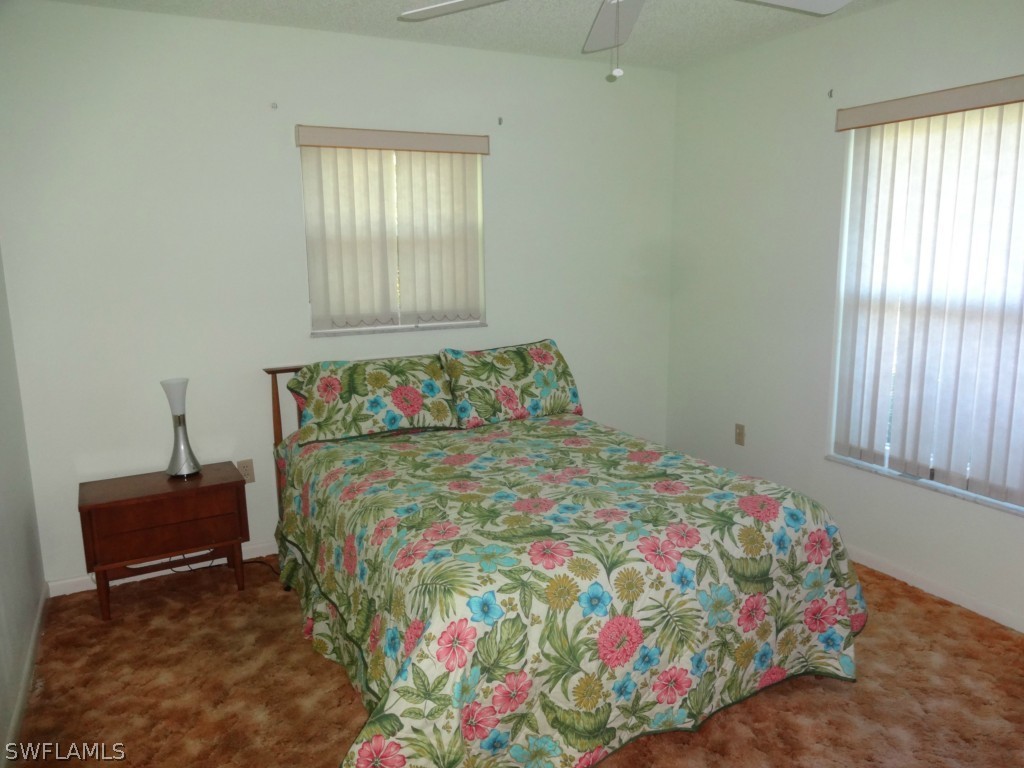 17537 Laurel Valley Road Fort Myers, FL 33967 - Photo 6 of 16 a bedroom with a bed and a window