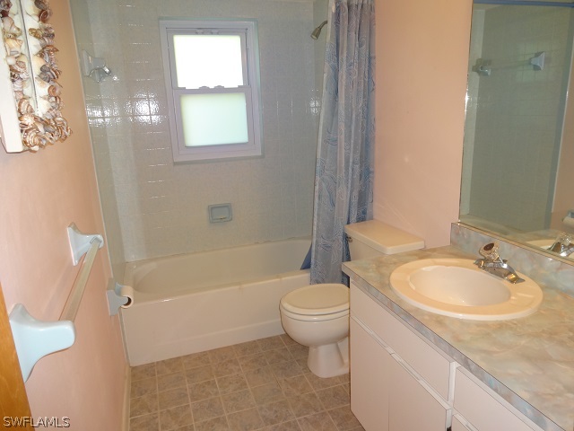 17537 Laurel Valley Road Fort Myers, FL 33967 - Photo 7 of 16 a bathroom with a sink toilet and shower