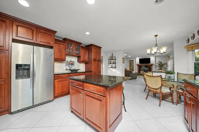 a kitchen with granite countertop stainless steel appliances a sink and counter space