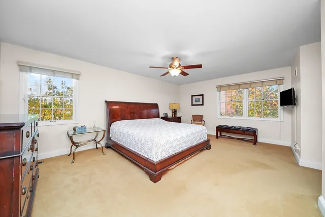 a bedroom with a bed and flat screen tv