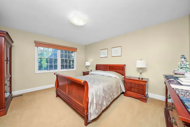 a bed room with a bed and a window