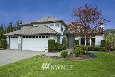 5506 Northeast 26th Street Renton, WA 98059 - Photo 1 of 1 a front view of a house with a yard and garage