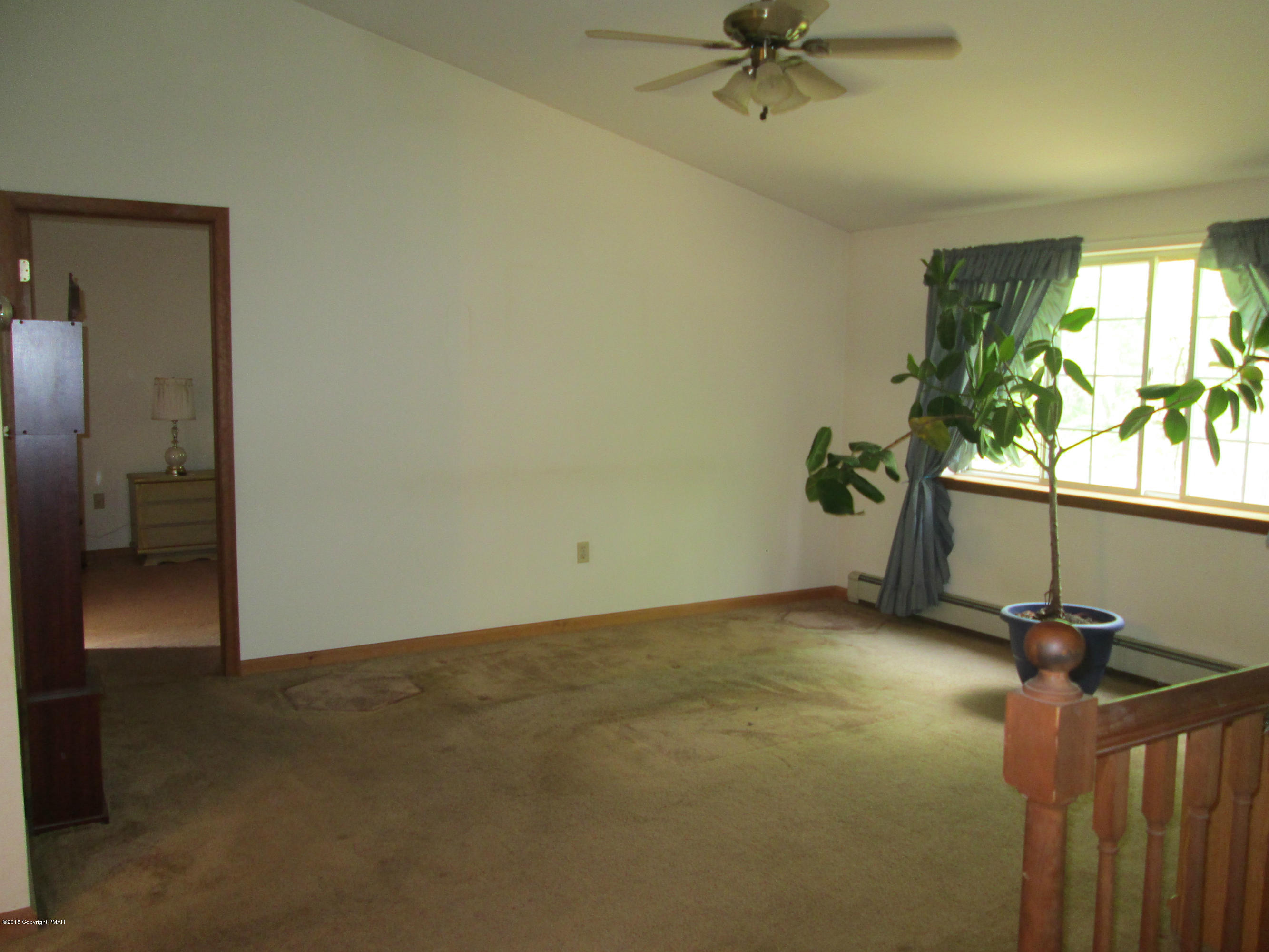 187 Shenkel Road Effort, PA 18330 - Photo 2 of 6 a view of a livingroom with a ceiling fan and window
