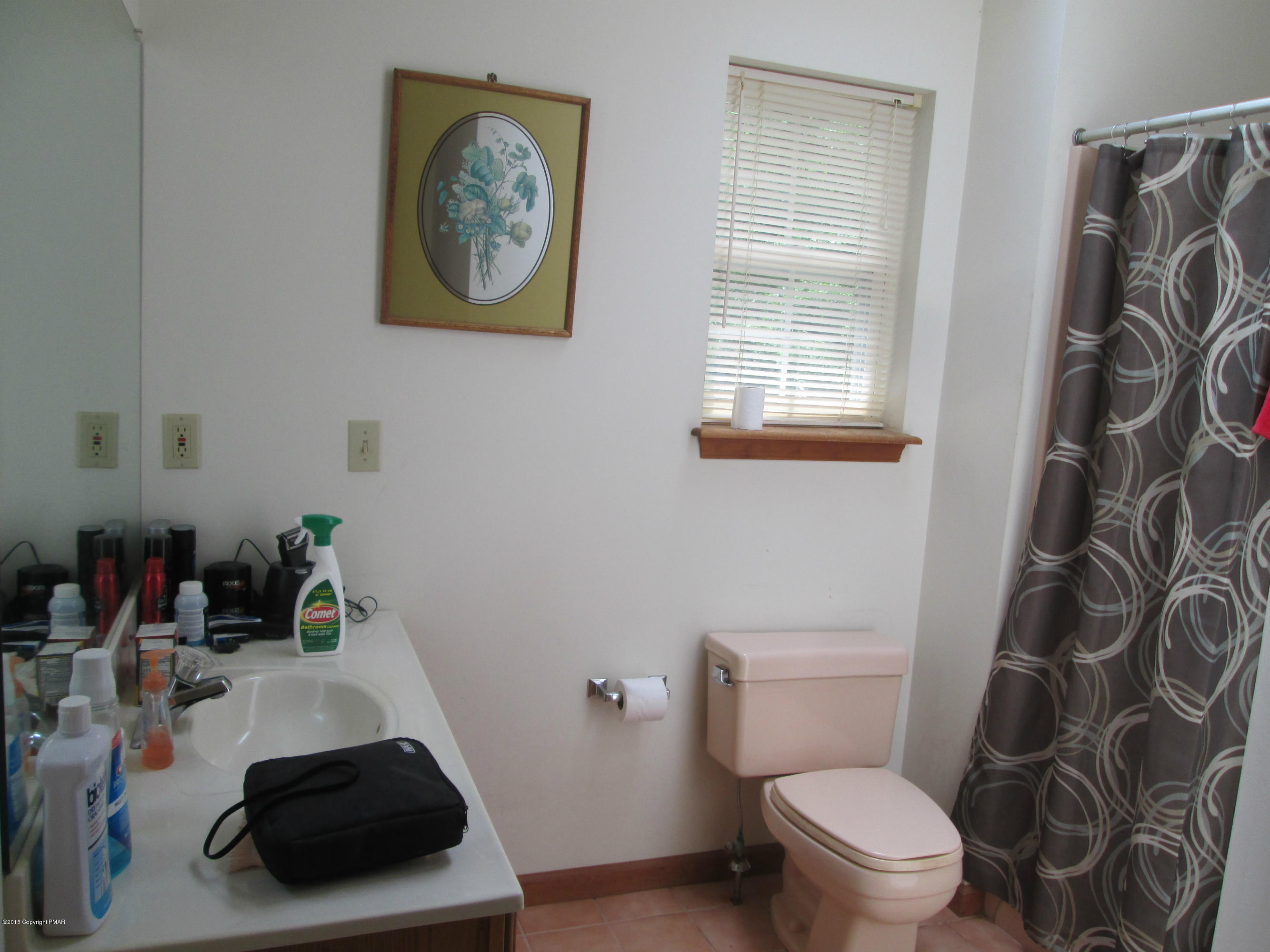 187 Shenkel Road Effort, PA 18330 - Photo 6 of 6 a bathroom with a toilet a sink and a window