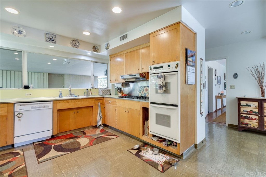 2000 Braeburn Road Altadena, CA 91001 - Photo 15 of 46 a kitchen with stainless steel appliances a stove a sink and a refrigerator