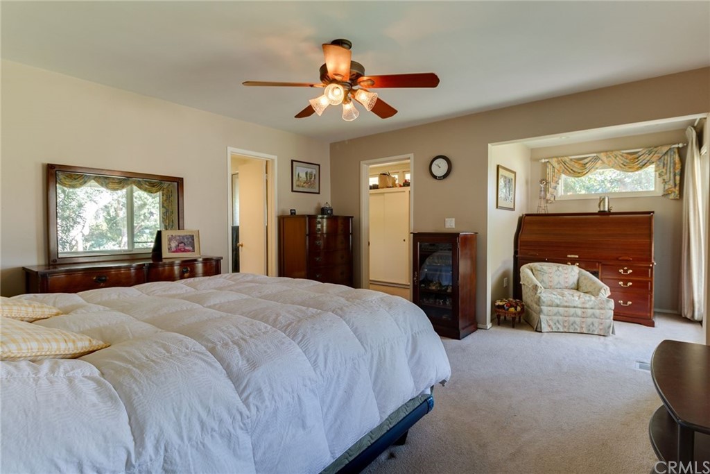 2000 Braeburn Road Altadena, CA 91001 - Photo 19 of 46 a bedroom with a bed and a chandelier