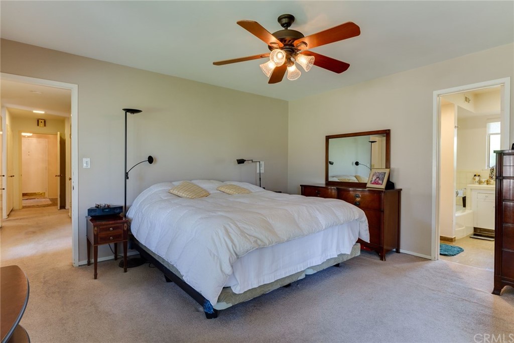 2000 Braeburn Road Altadena, CA 91001 - Photo 21 of 46 a bedroom with a bed a chandelier and a dresser