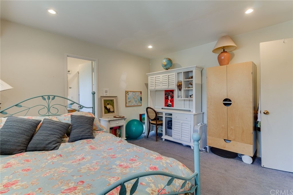 2000 Braeburn Road Altadena, CA 91001 - Photo 27 of 46 a bedroom with a bed and a chandelier