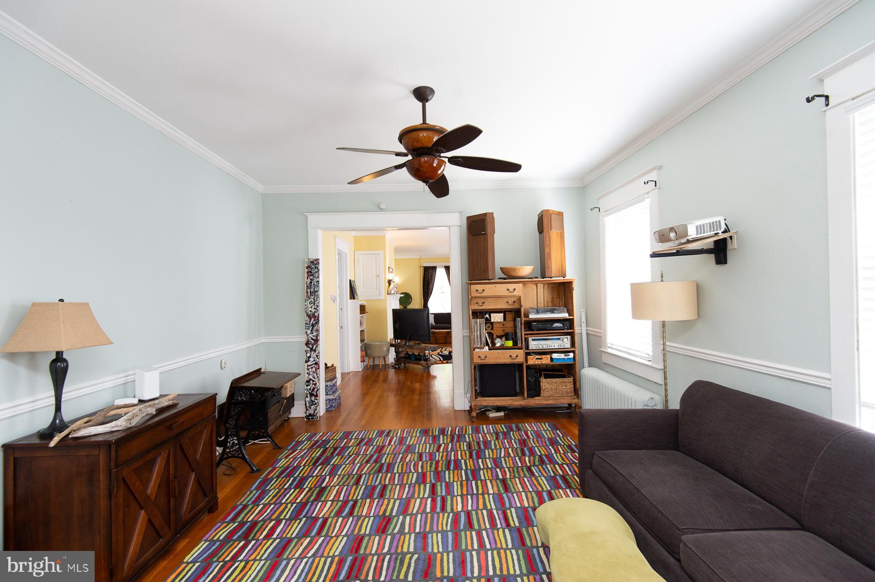 606 Locust Street Cambridge, MD 21613 - Photo 12 of 37 a living room with furniture and a chandelier