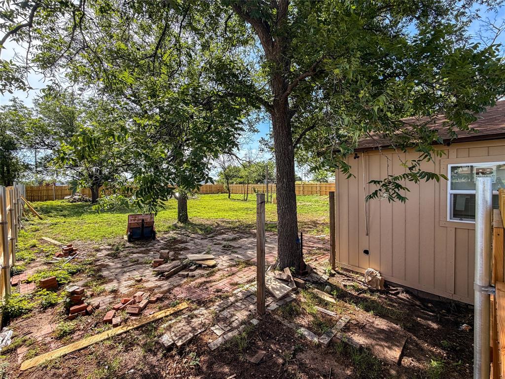 506 North Ave B Haskell, TX 79521 - Photo 12 of 13 a view of a yard with large trees and plants