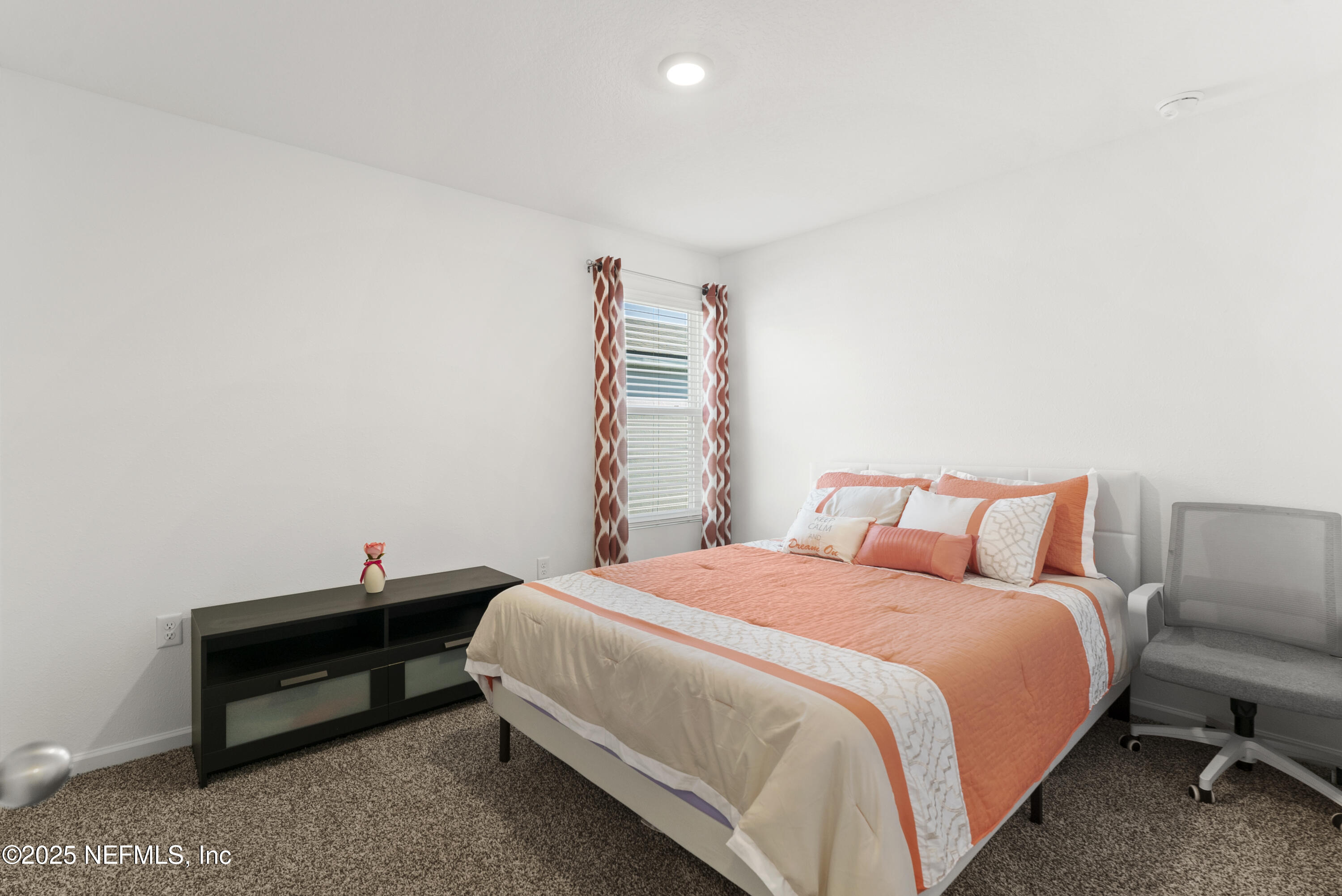 12698 Cucumber Tree Street Jacksonville, FL 32218 - Photo 11 of 26 a bed room with a bed and a chair