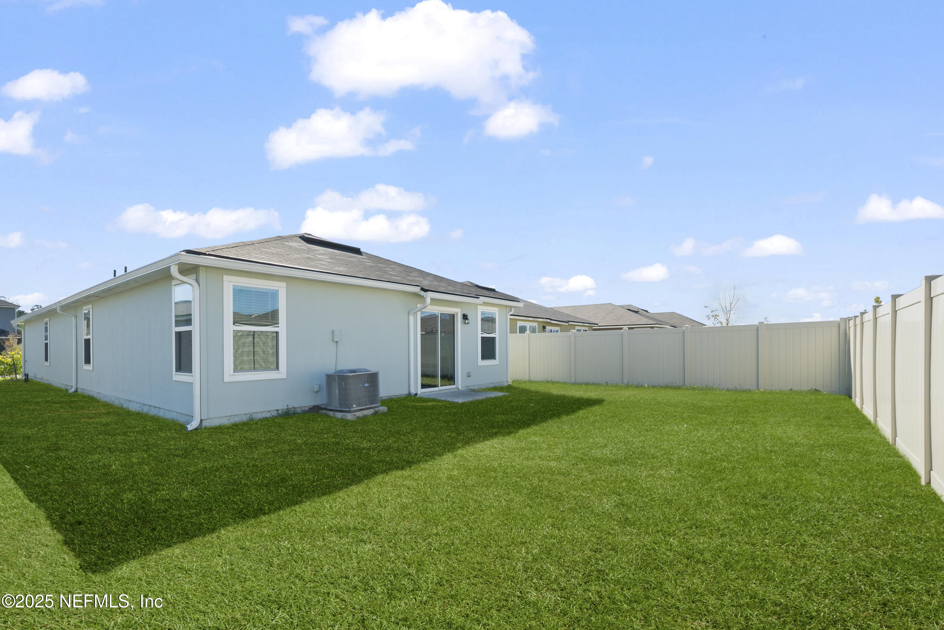 12698 Cucumber Tree Street Jacksonville, FL 32218 - Photo 15 of 26 a view of a yard with a house