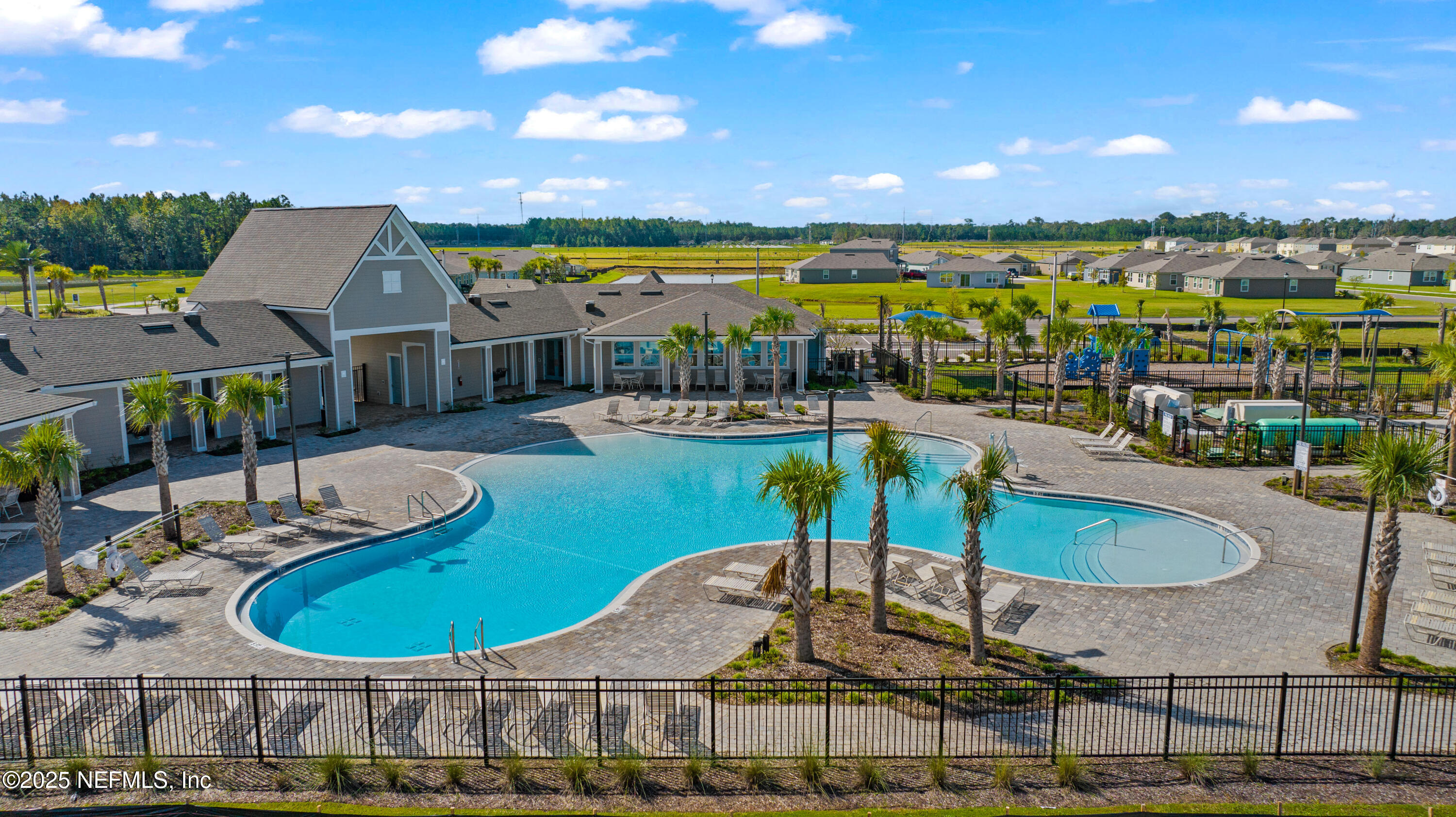 12698 Cucumber Tree Street Jacksonville, FL 32218 - Photo 2 of 26 a view of a swimming pool with a table and chairs