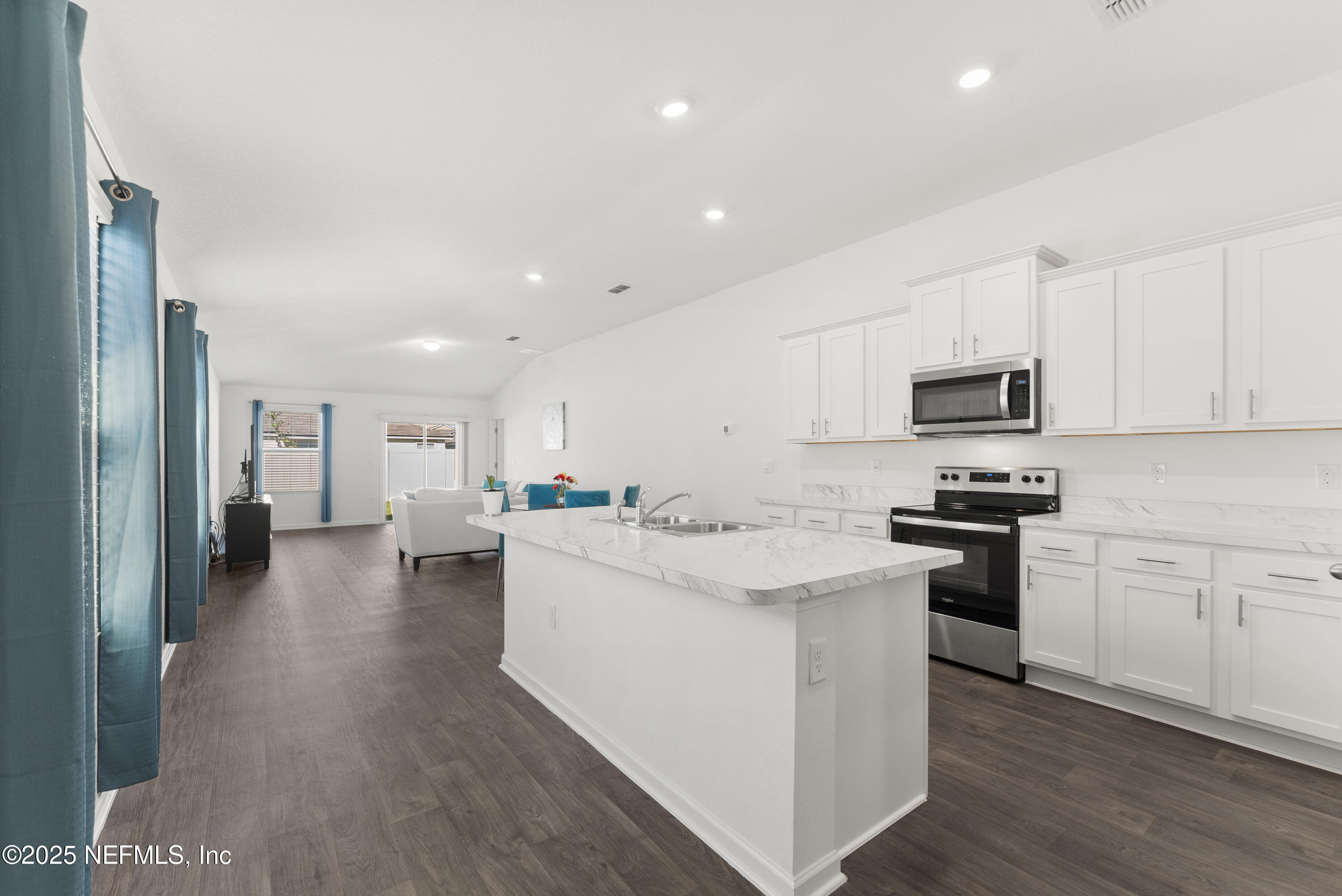 12698 Cucumber Tree Street Jacksonville, FL 32218 - Photo 4 of 26 a kitchen with cabinets and stainless steel appliances