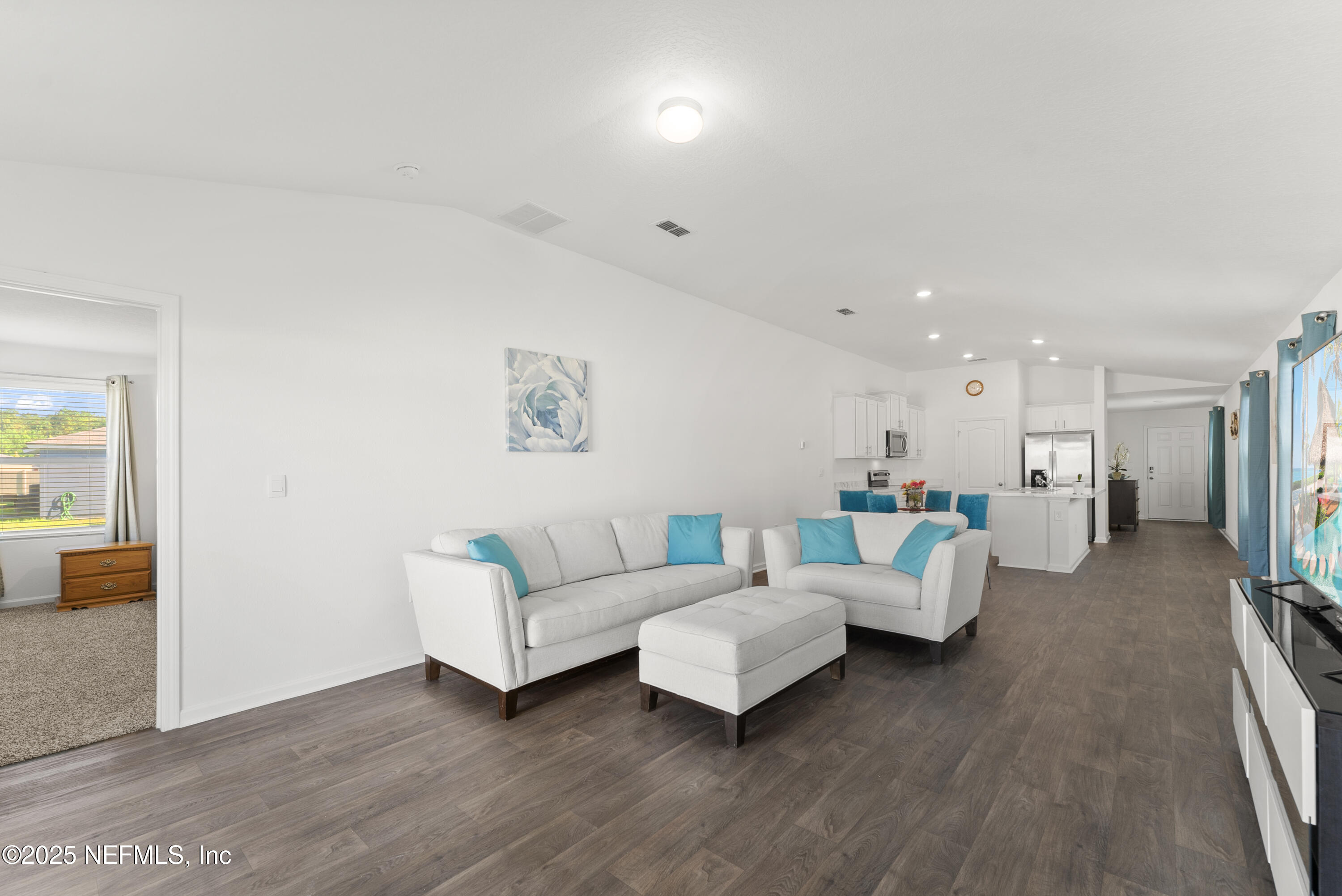 12698 Cucumber Tree Street Jacksonville, FL 32218 - Photo 6 of 26 a living room with furniture and wooden floor