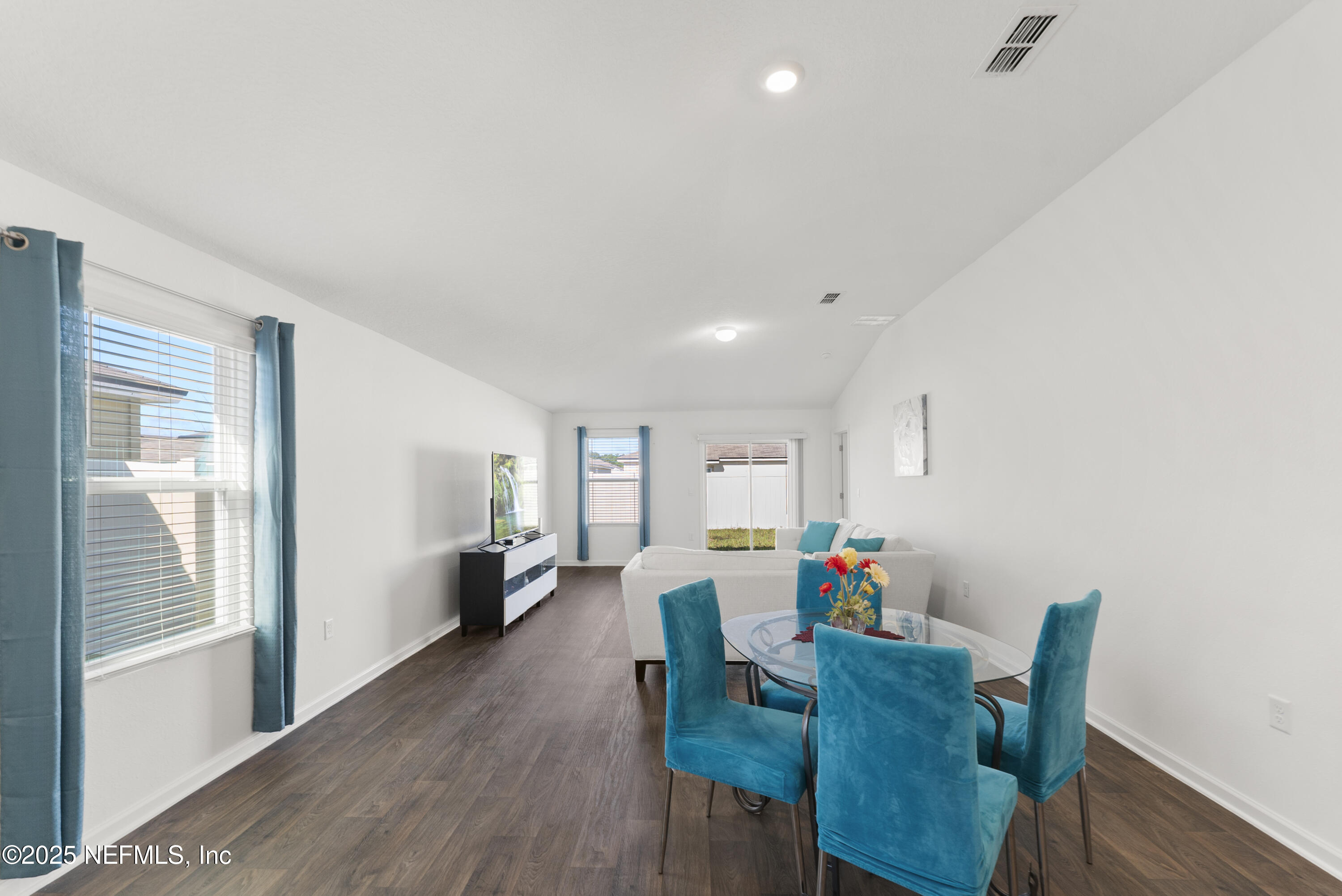 12698 Cucumber Tree Street Jacksonville, FL 32218 - Photo 7 of 26 a living room with furniture and a wooden floor