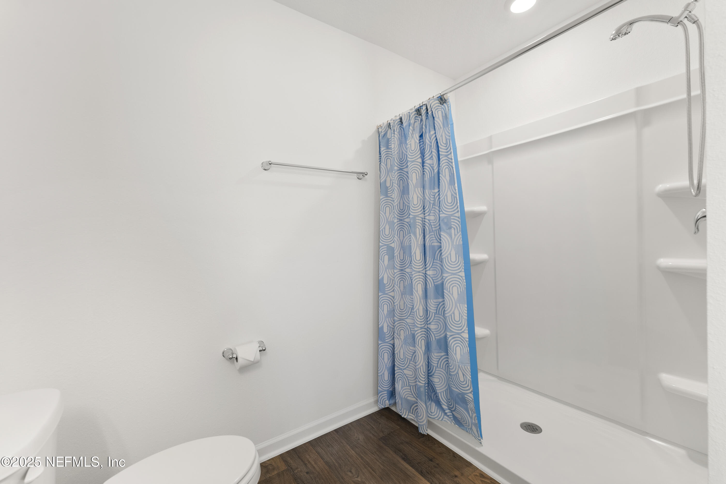 12698 Cucumber Tree Street Jacksonville, FL 32218 - Photo 10 of 26 a bathroom with a shower and a toilet