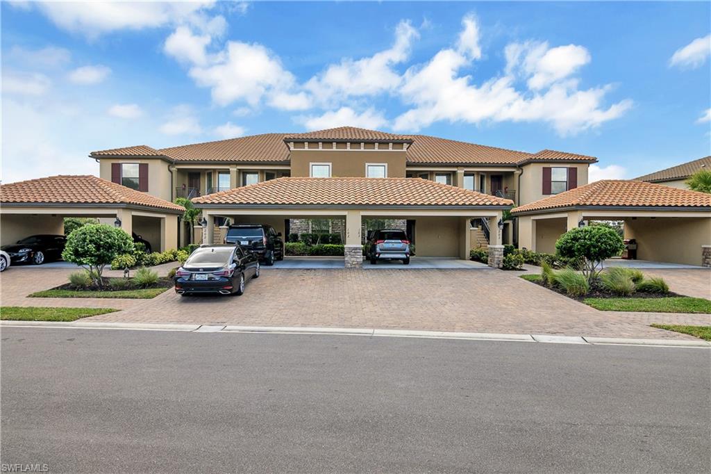 9440 Benvenuto Court, Unit 3204 Naples, FL 34119 - Photo 12 of 28 a car parked in front of a white house