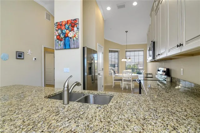 a view of a kitchen with appliances and cabinets