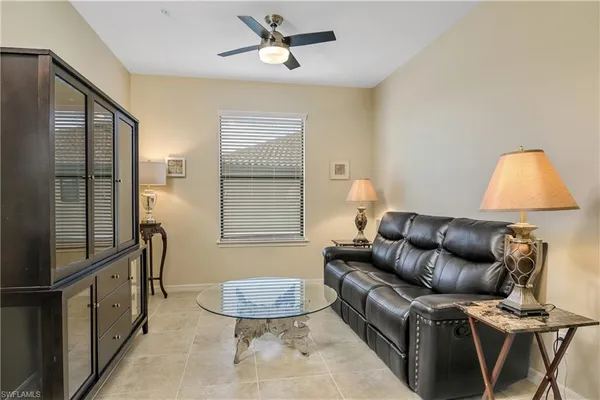 a living room with furniture and a window