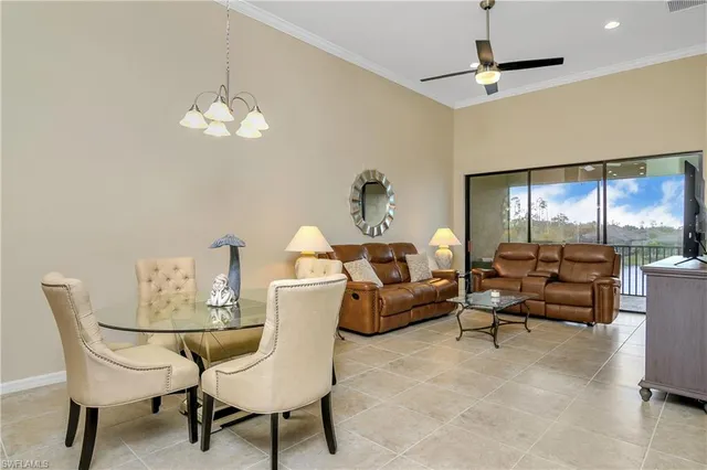 a living room with furniture chandelier and a chandelier
