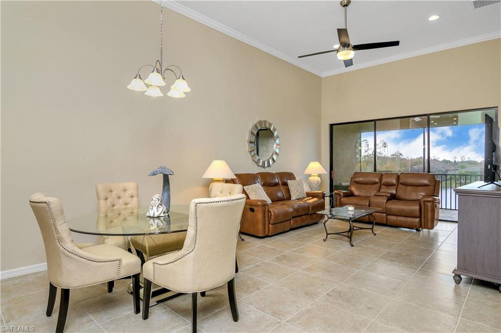 9440 Benvenuto Court, Unit 3204 Naples, FL 34119 - Photo 9 of 28 a living room with furniture chandelier and a chandelier
