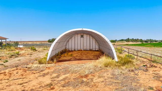 a view of swimming pool with a yard