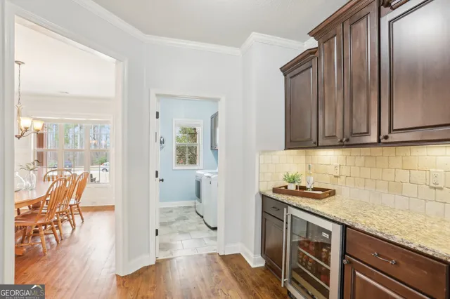 a living room with a fireplace and windows