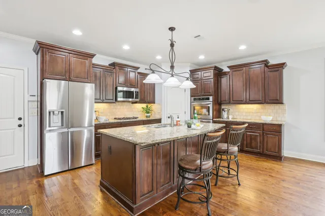a bedroom with a bed a window and a flat screen tv