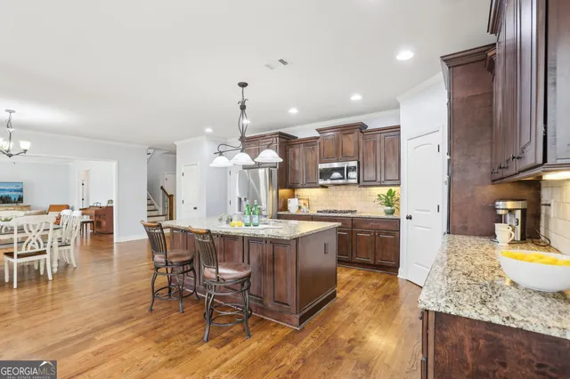 a bathroom with a tub a sink and a shower