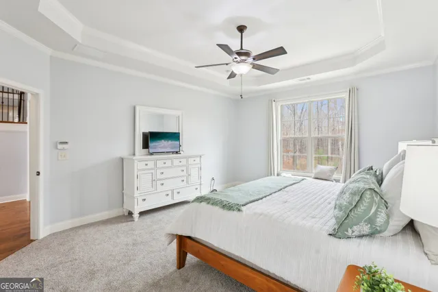 a bathroom with a toilet and a mirror