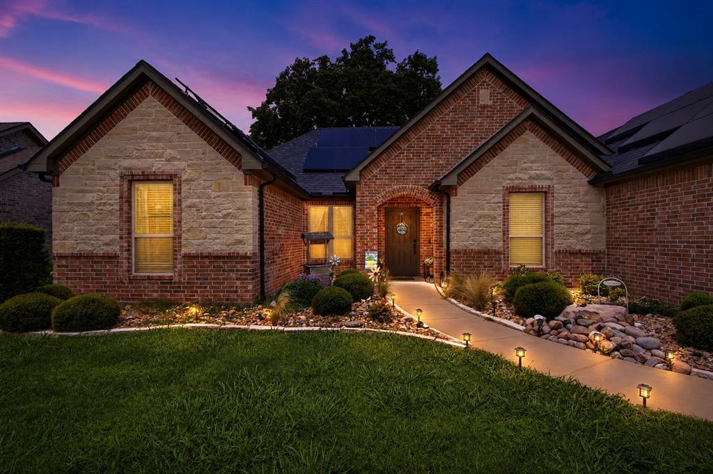701 West Lamberth Road Sherman, TX 75092 - Photo 2 of 37 Brick and stone exterior with a gabled roofline