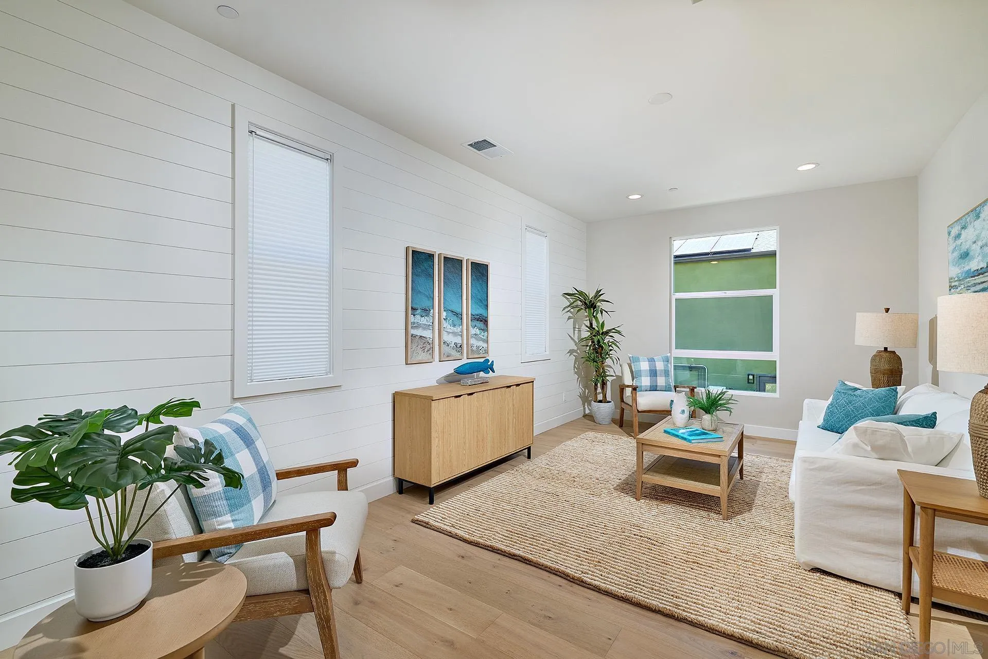 555 North Vulcan Avenue Encinitas, CA 92024 - Photo 14 of 32 a living room with furniture and a potted plant