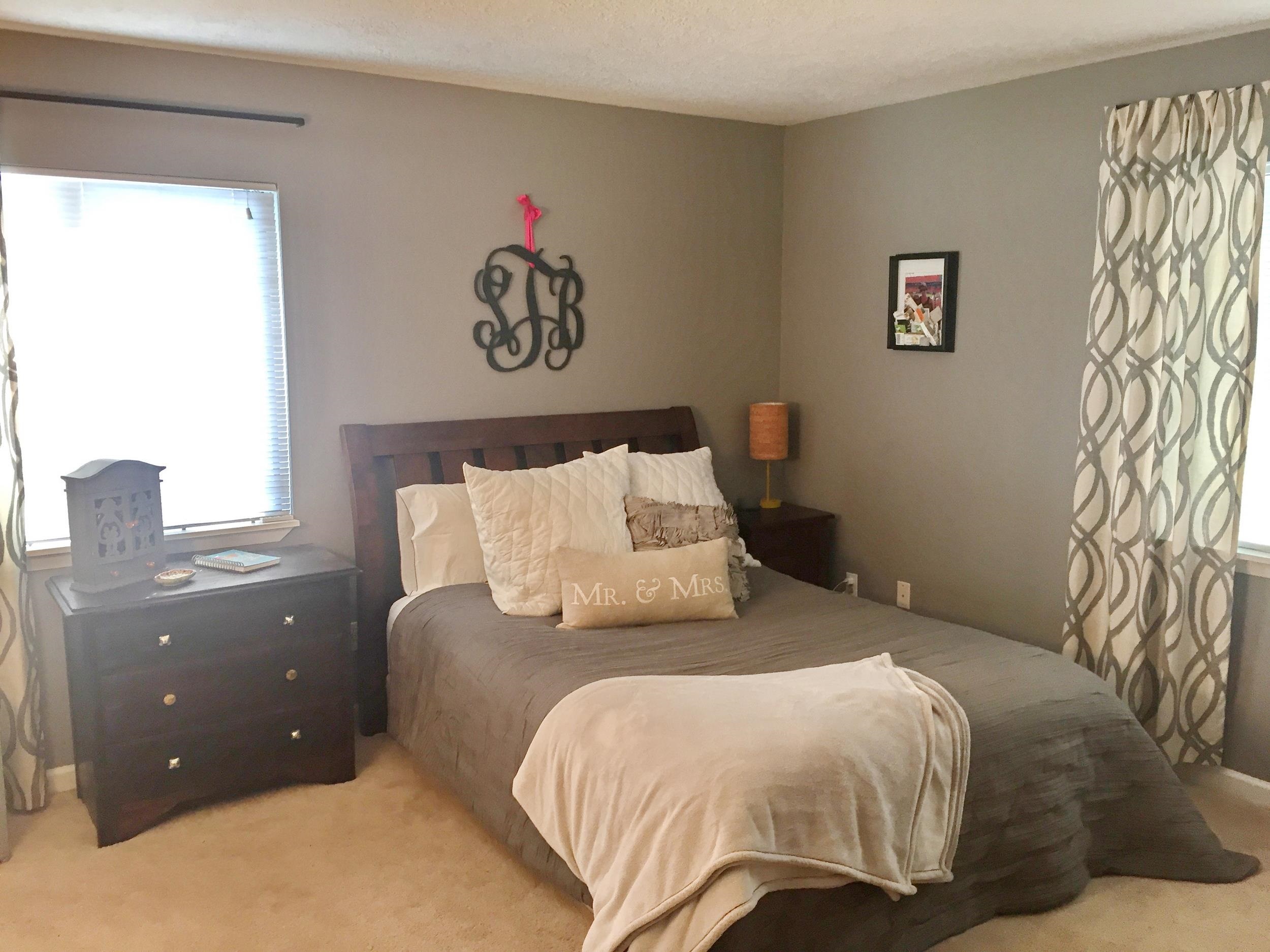 213 A Street St. Augustine, FL 32080 - Photo 15 of 29 a bedroom with a bed and a chandelier