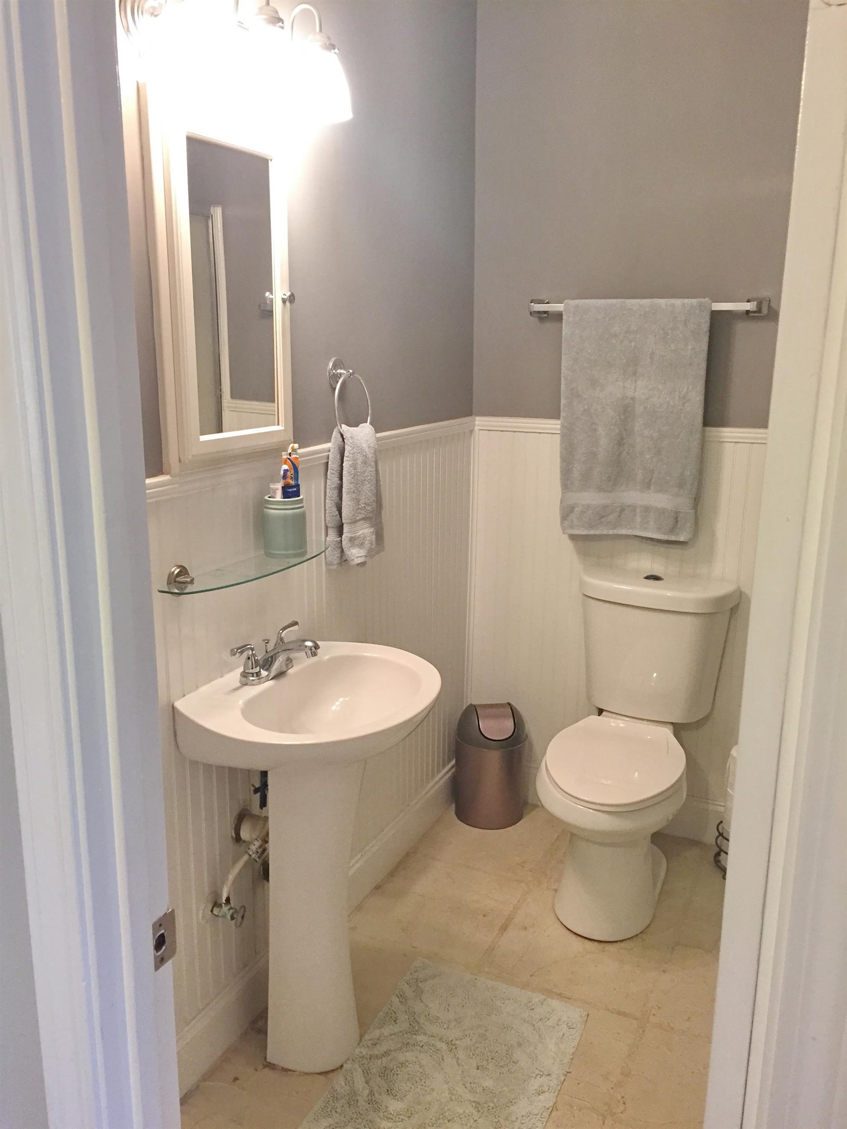 213 A Street St. Augustine, FL 32080 - Photo 21 of 29 a bathroom with a toilet a sink and mirror