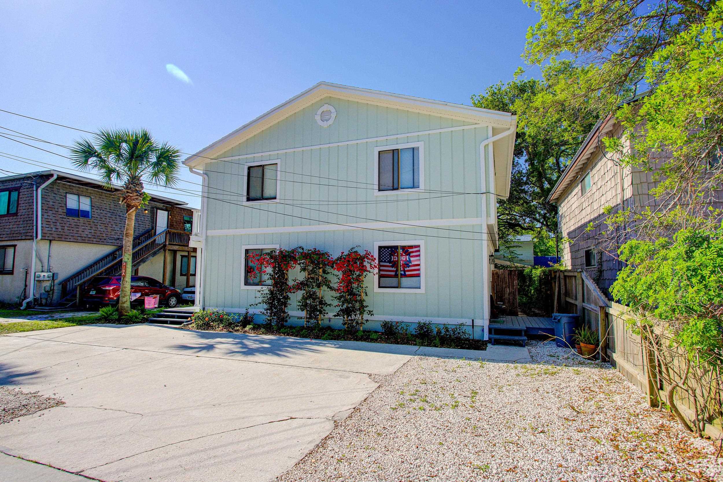 213 A Street St. Augustine, FL 32080 - Photo 3 of 29 a front view of a house with a yard