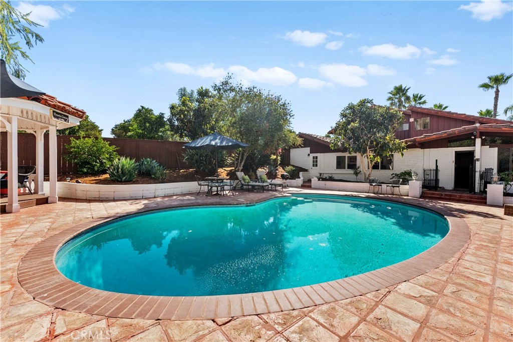 11550 Old Castle Road Valley Center, CA 92082 - Photo 19 of 60 Pool deck with entrance to the main house & guest suite